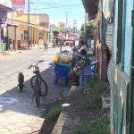 One of the street sellers outside their homes