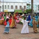 School children dancing in their colourful costumes